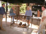 Men gossiping around the fire.